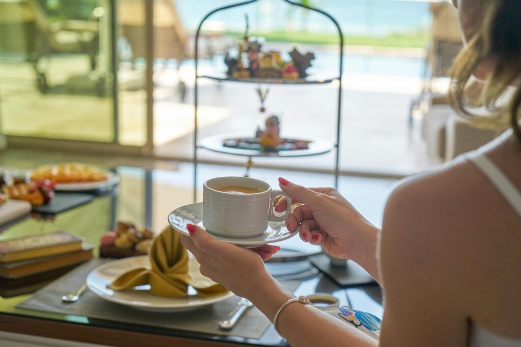 A serene morning coffee experience with a view, capturing elegance and relaxation indoors.