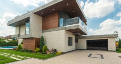 Contemporary luxury house with a sleek design, lush garden, and blue sky.