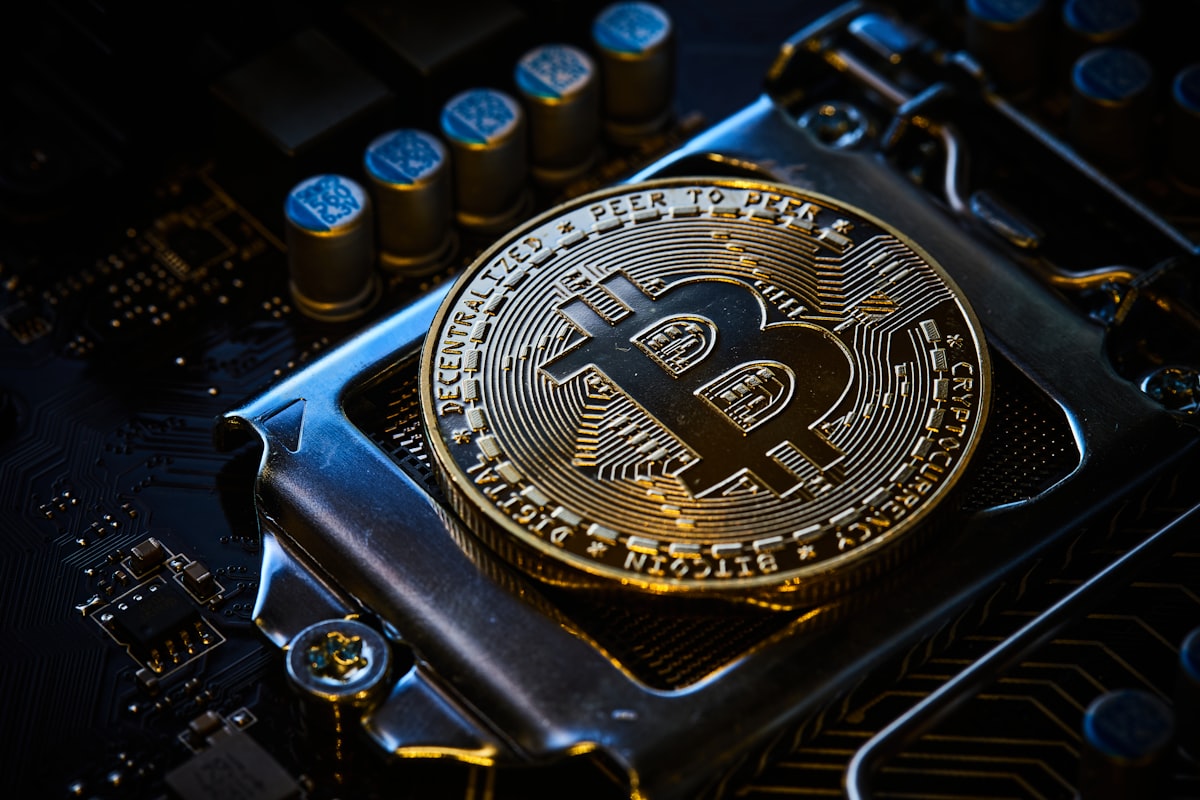 Bitcoin on computer motherboard — stablecoin technology and blockchain