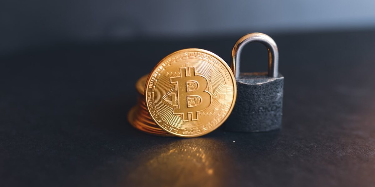 How to protect your crypto — Bitcoin secured by padlock representing hardware wallet security in 2026