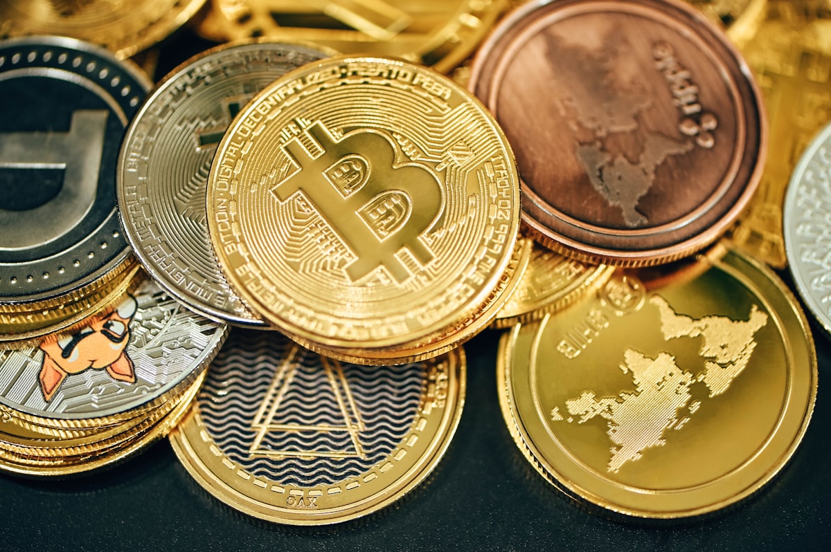 Gold and silver Bitcoin coins — crypto stablecoin investing 2026