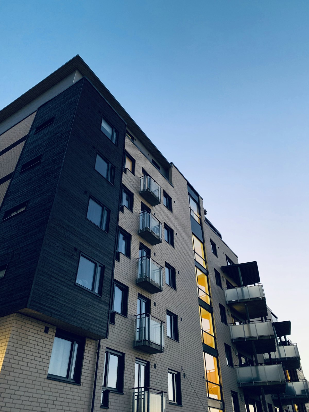 REITs vs rentals vs crowdfunding — apartment building representing real estate investment options in 2026