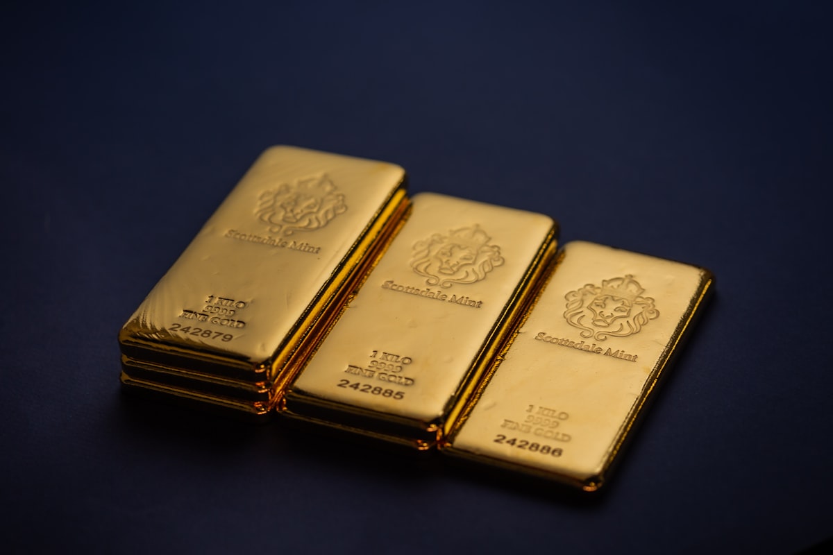 Three gleaming gold bars — where to buy gold in 2026