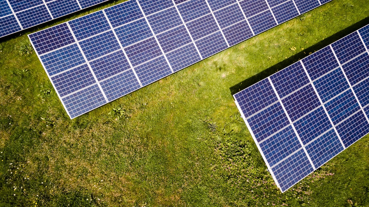 Aerial view of a solar farm, part of the buildout AI energy infrastructure stocks are betting on