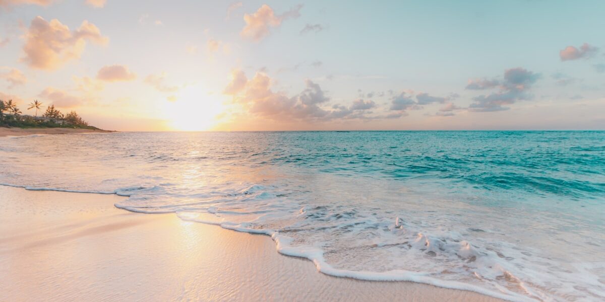 how to retire early using the FIRE movement, sunrise over the ocean