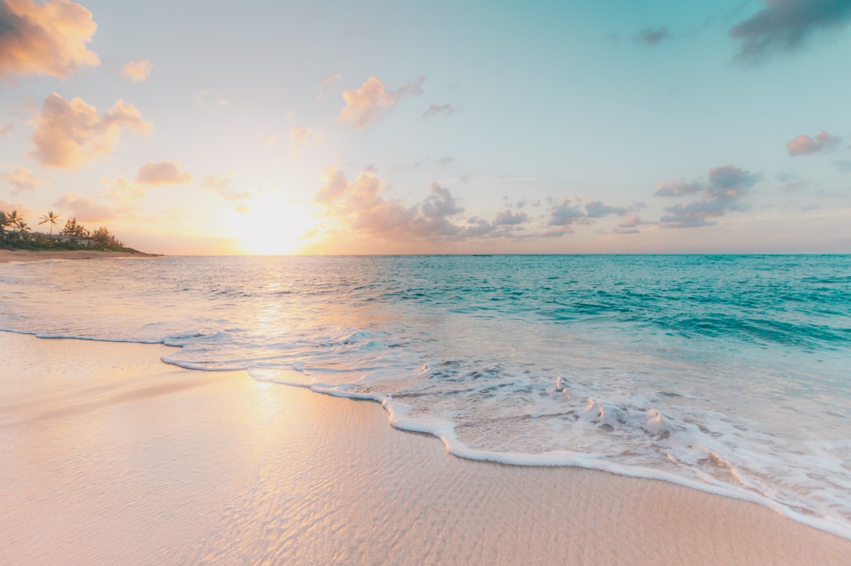how to retire early using the FIRE movement, sunrise over the ocean