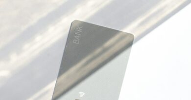 A credit card on a table representing the personal loan vs balance transfer decision for paying off debt
