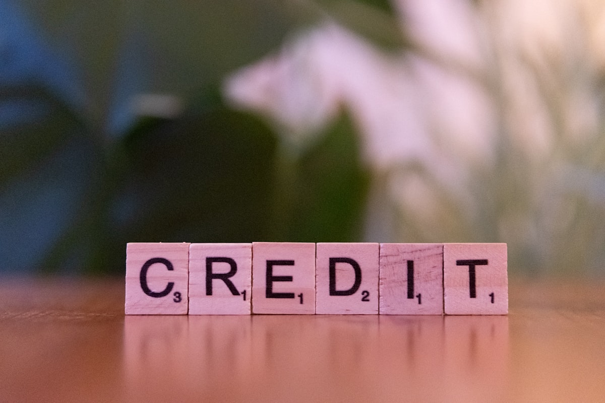 Wooden blocks spelling credit, representing the credit utilization ratio that shapes your score