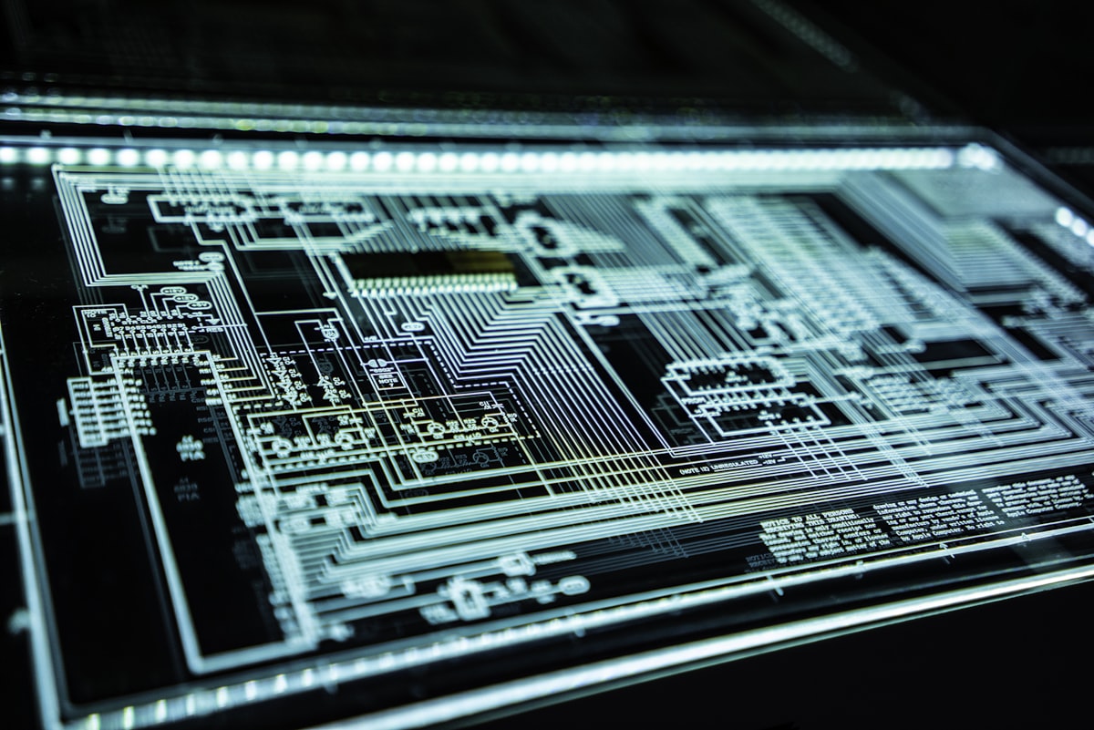 A glowing AI chip and circuit board, the modern picks-and-shovels infrastructure behind the AI income story